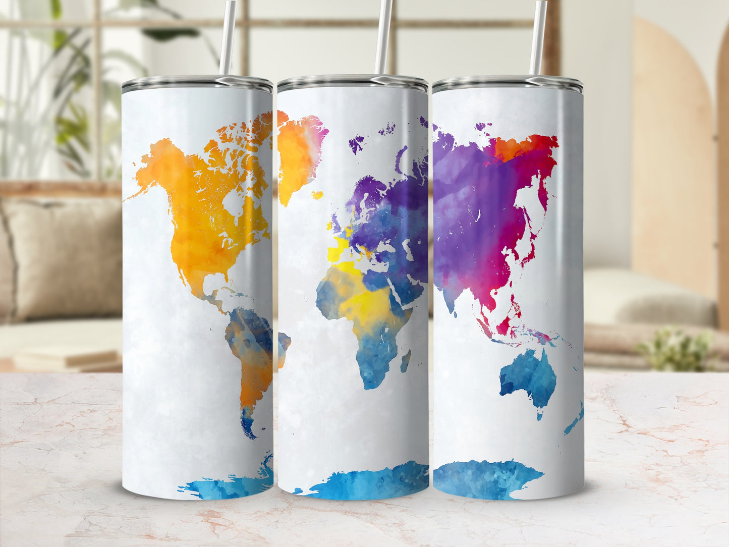 Three tumblers with watercolor maps of the world in vibrant colors.