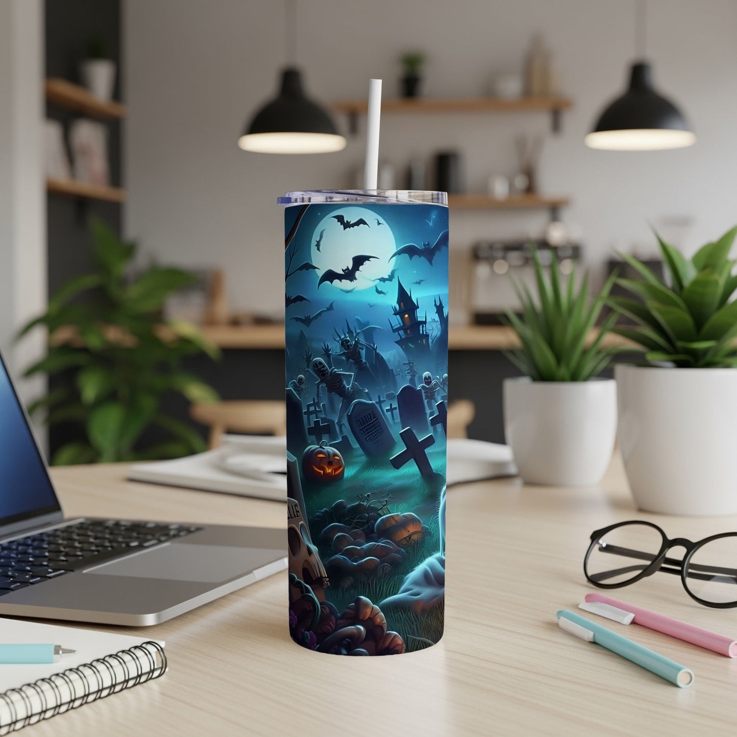 Tall tumbler with a spooky graveyard and full moon Halloween scene.