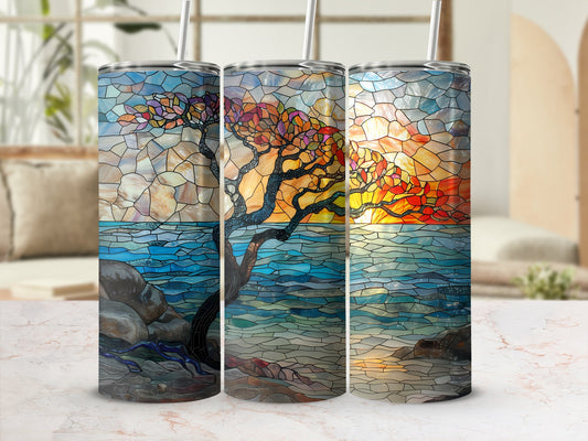 Triptych of stained glass tumblers featuring a sunset over a rocky shoreline with a tree.