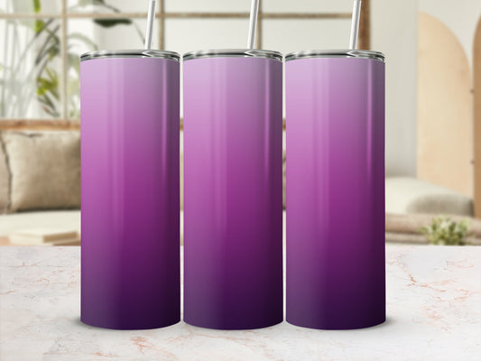 Three purple gradient tumblers with straws on a marble surface.