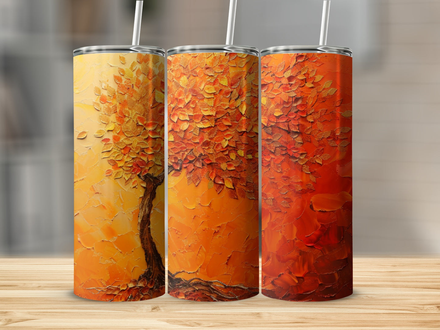 Three tumblers with abstract textured autumn tree designs in warm orange and red hues.