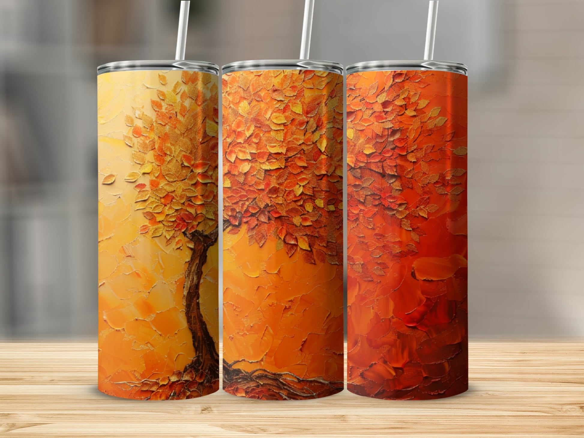 Three tumblers with abstract textured autumn tree designs in warm orange and red hues.