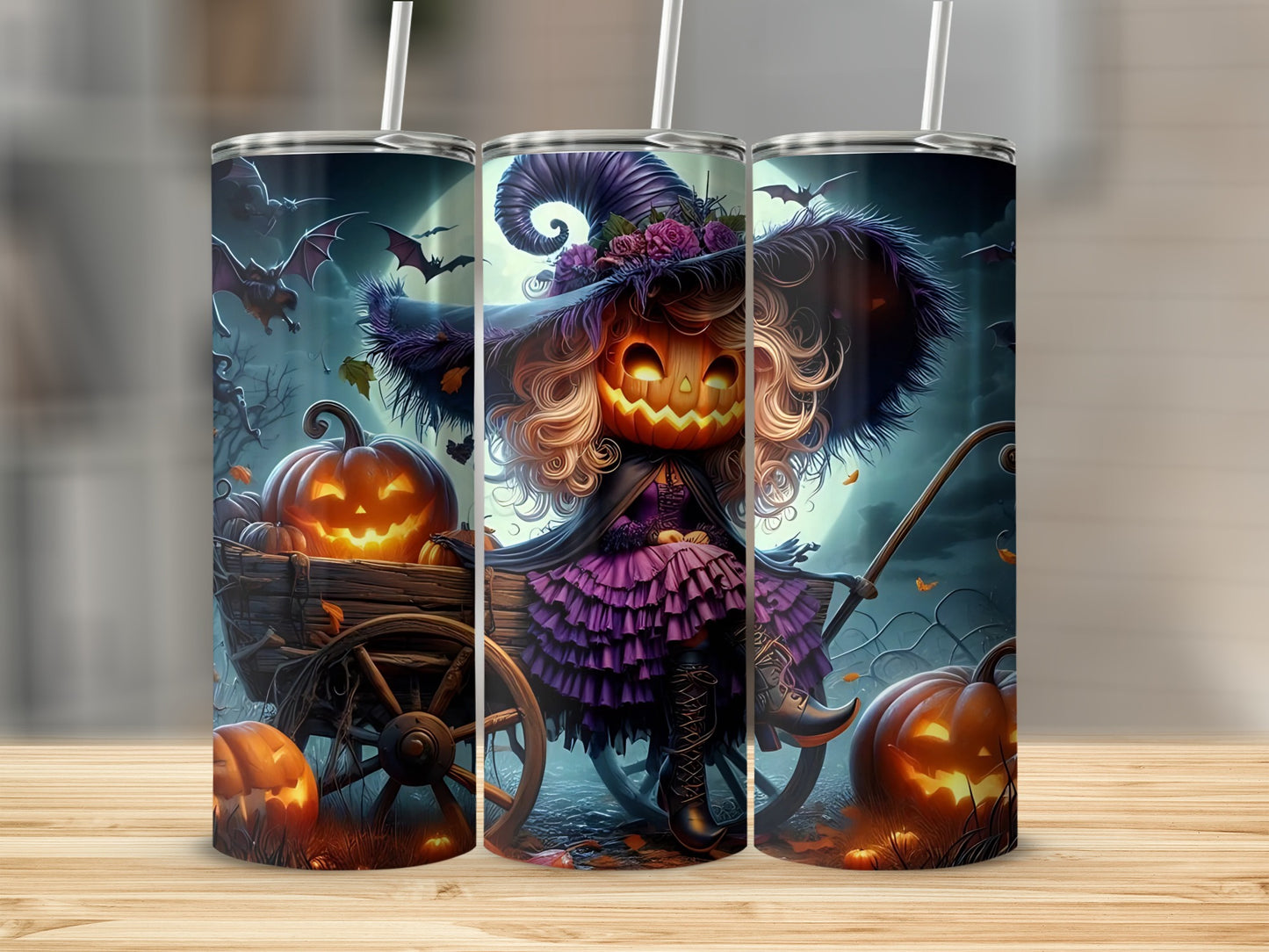 Halloween tumbler with jack-o'-lantern witch, bats, and pumpkins in a wagon.