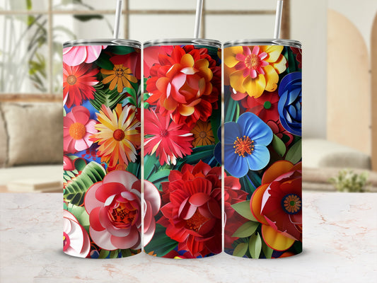 Three floral patterned tumblers with straws.