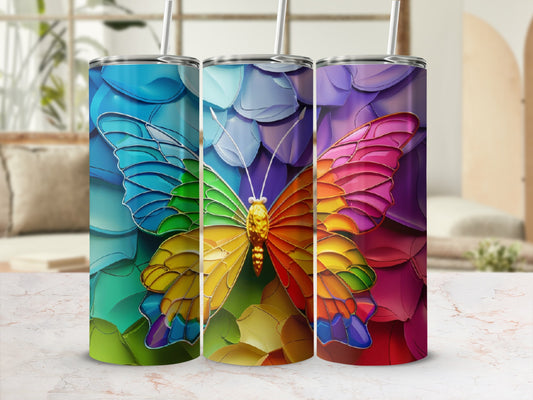Three colorful butterfly tumblers with stained glass wings and straws.