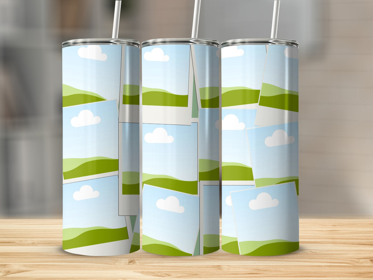 Three tall tumblers with straw display a collage of sky, clouds, and green hills.
