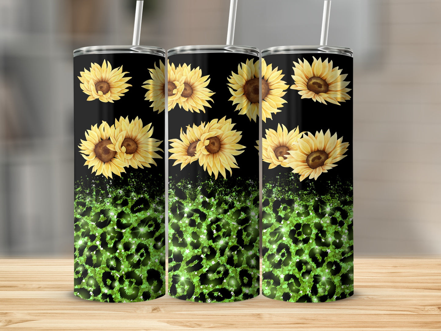Three tumblers with sunflowers and green leopard print on a black background.
