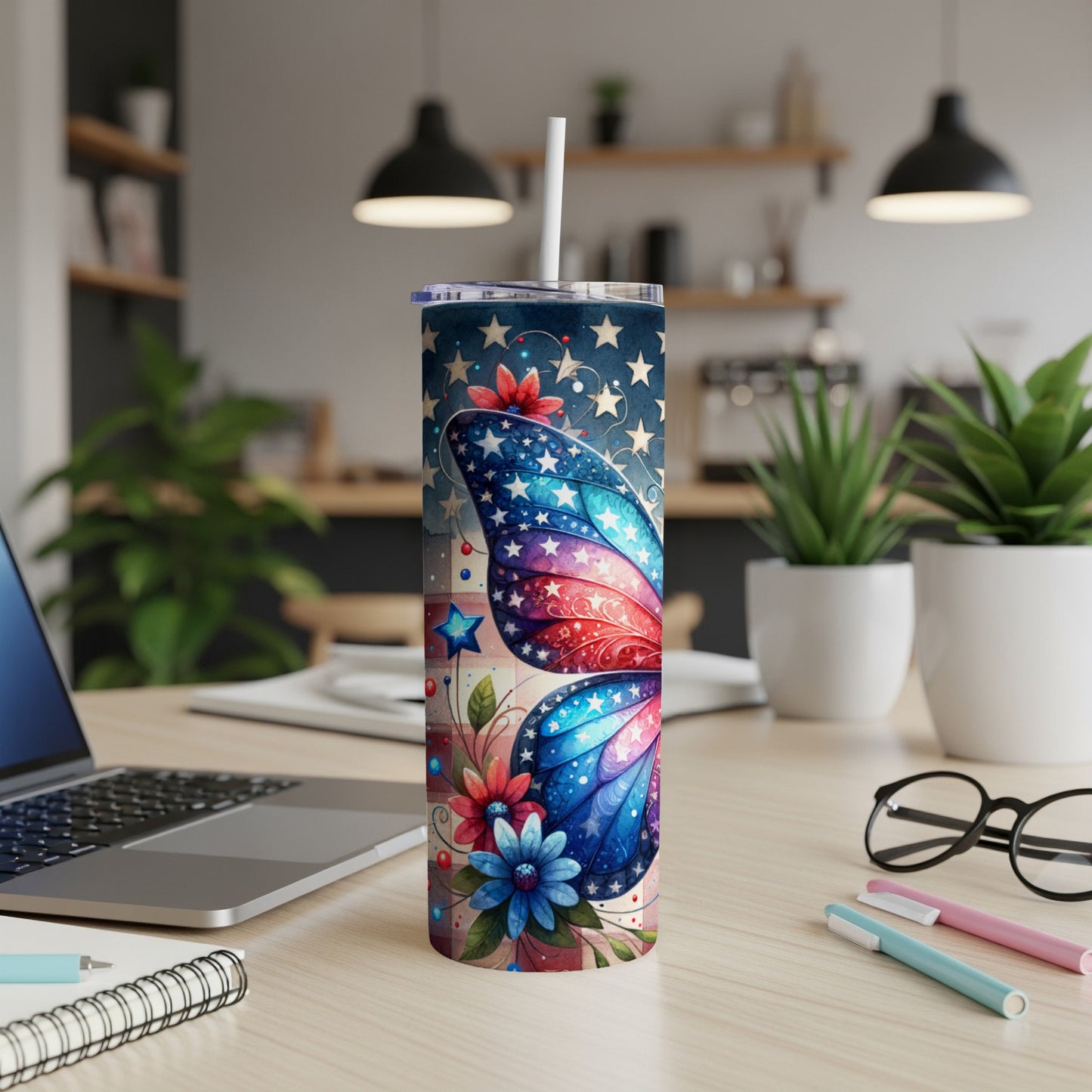Red, white, and blue butterfly tumbler with stars and flowers.