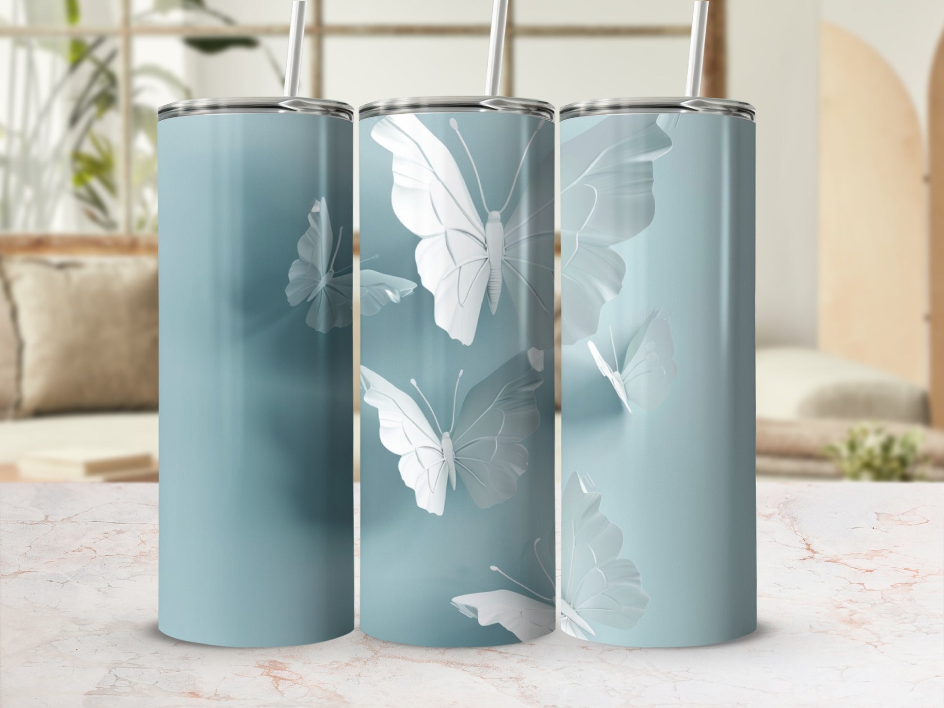 Three pastel blue tumblers with white butterfly designs.
