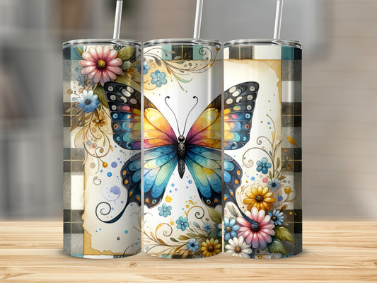 Three tumblers featuring a colorful butterfly and floral designs on a plaid background.