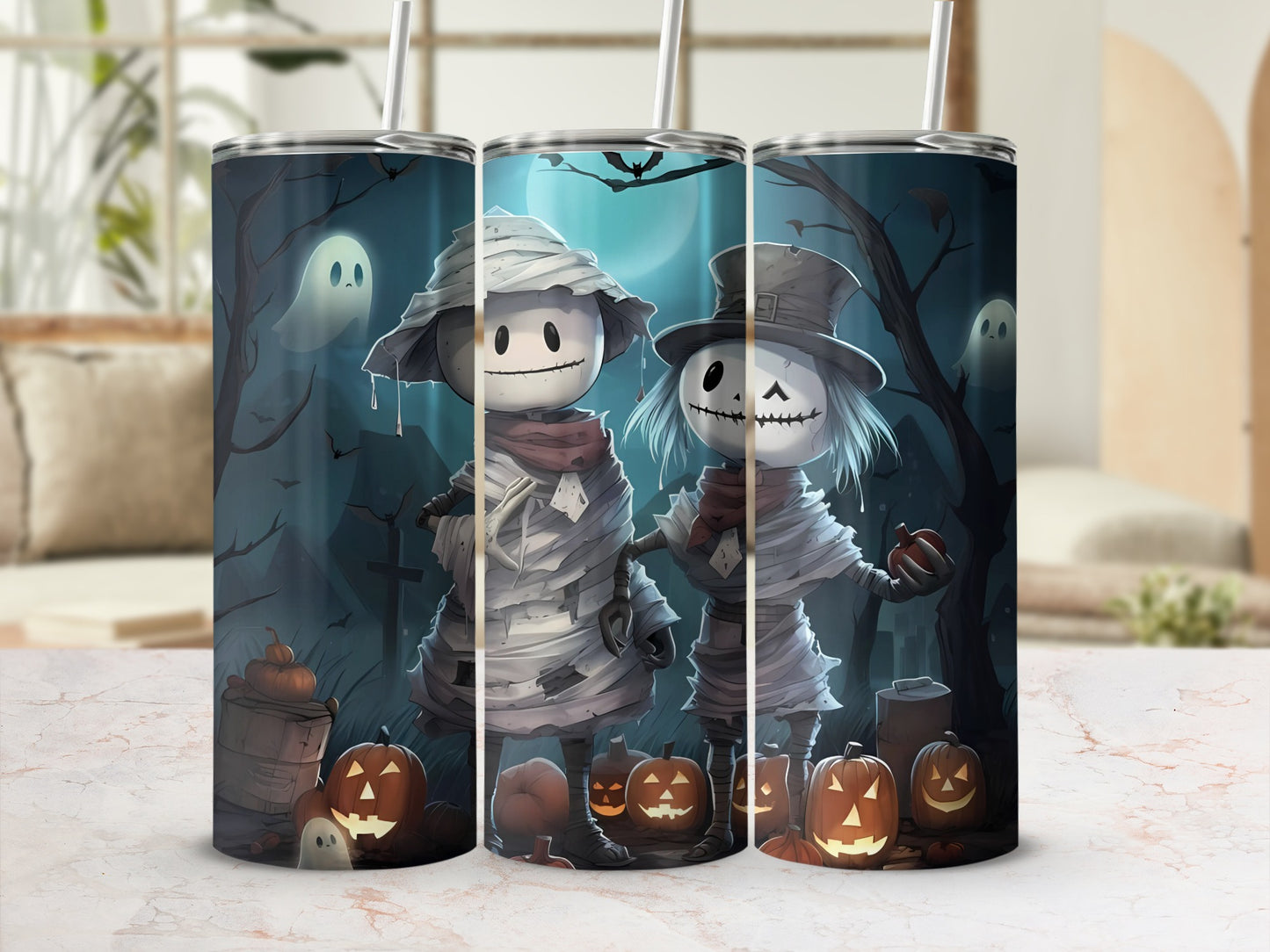 Two mummy characters with pumpkins and ghosts on a Halloween-themed tumbler.