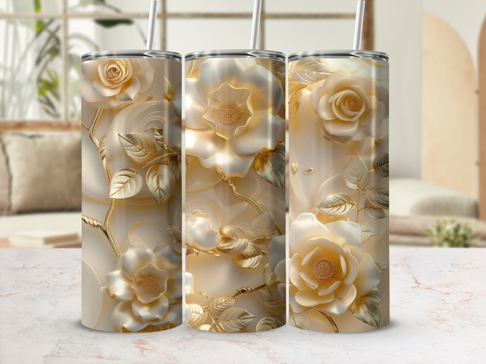 Three white floral tumblers with gold accents and straws.