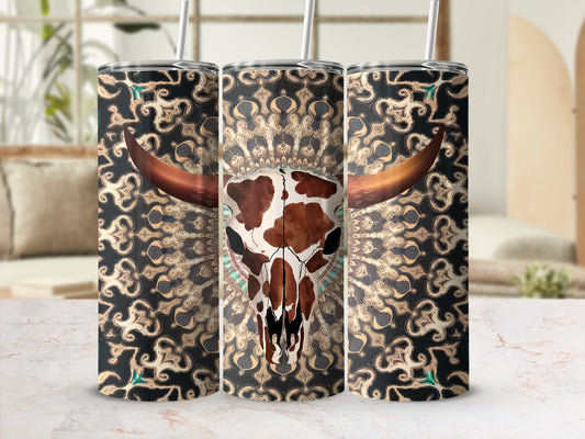 Bull skull with tribal pattern on a patterned tumbler.