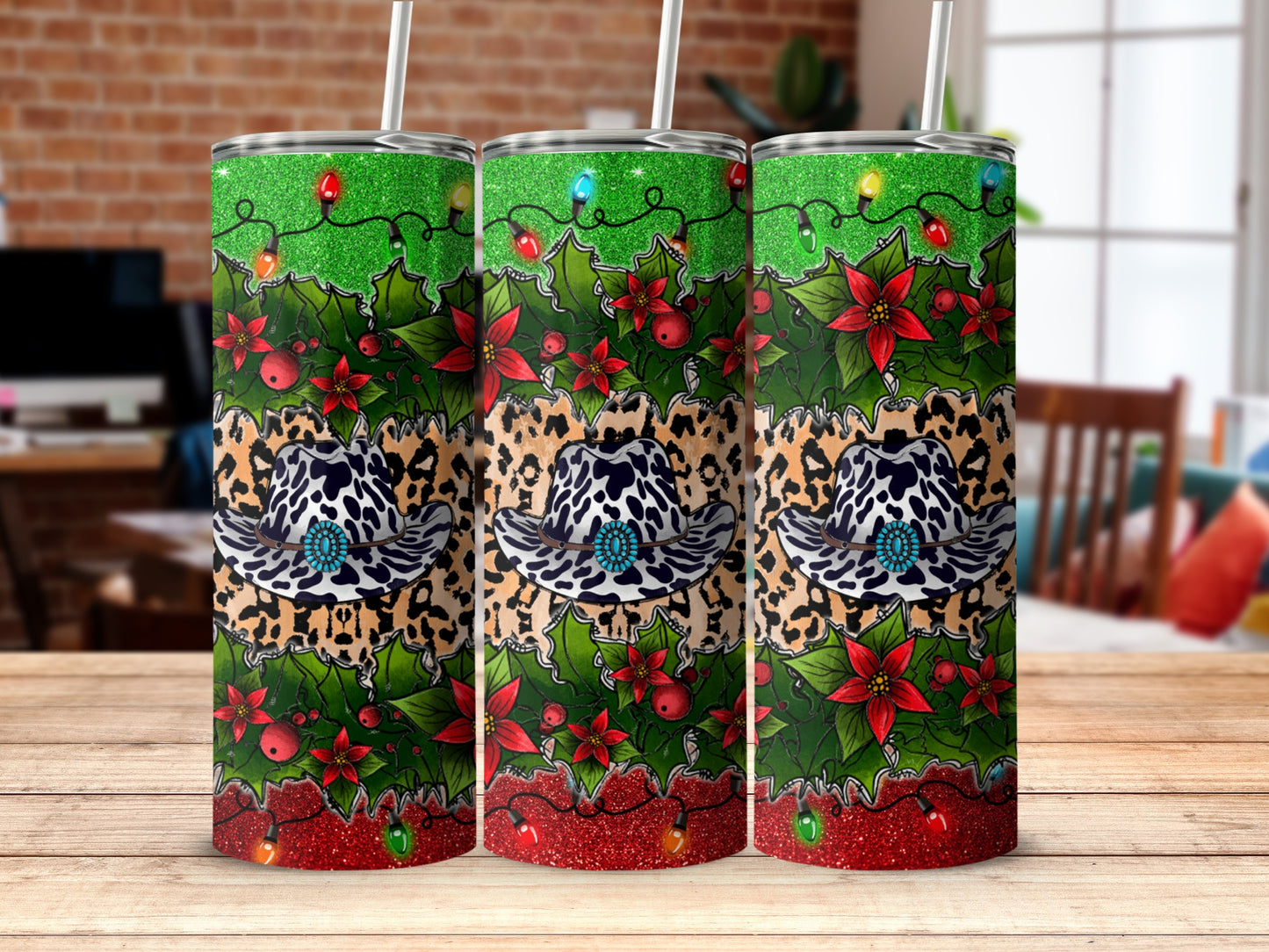 Tumbler with cowboy hat, holly, poinsettias, and Christmas lights pattern.