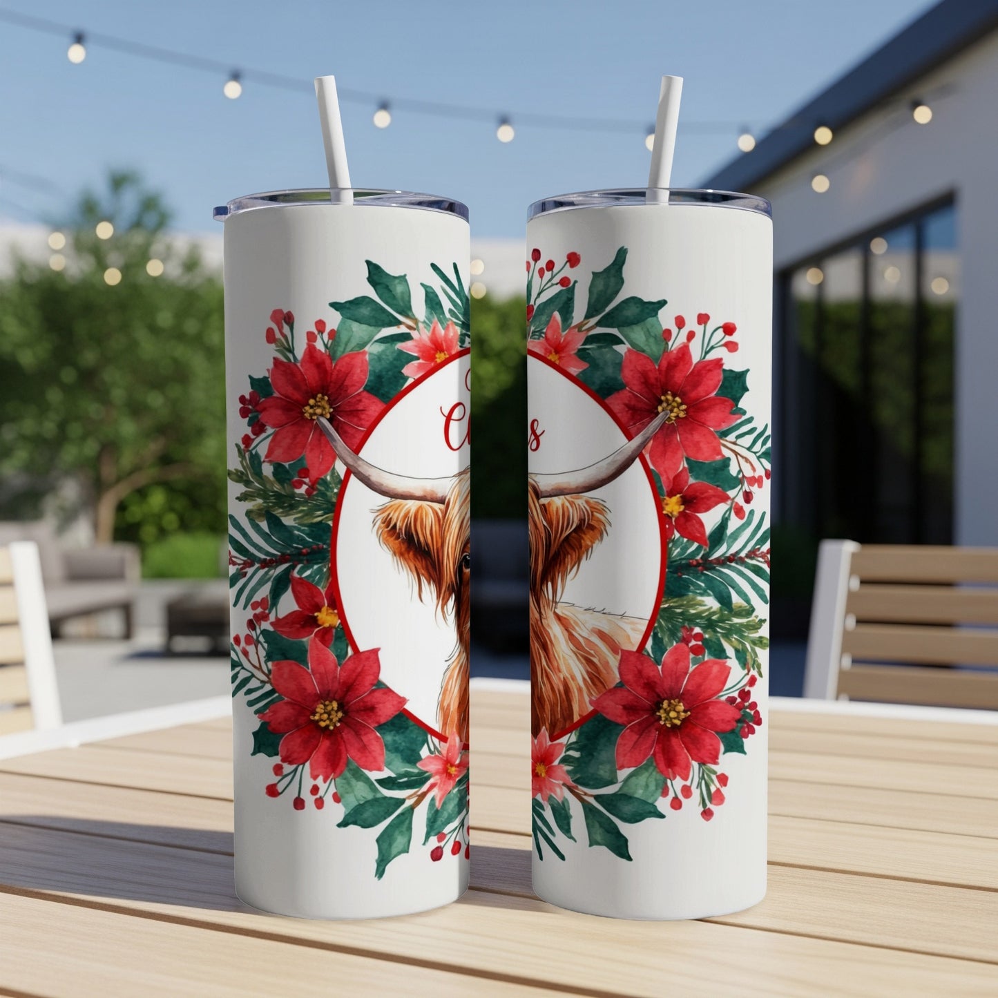 Two tumblers decorated with a Highland cow and poinsettia wreath.