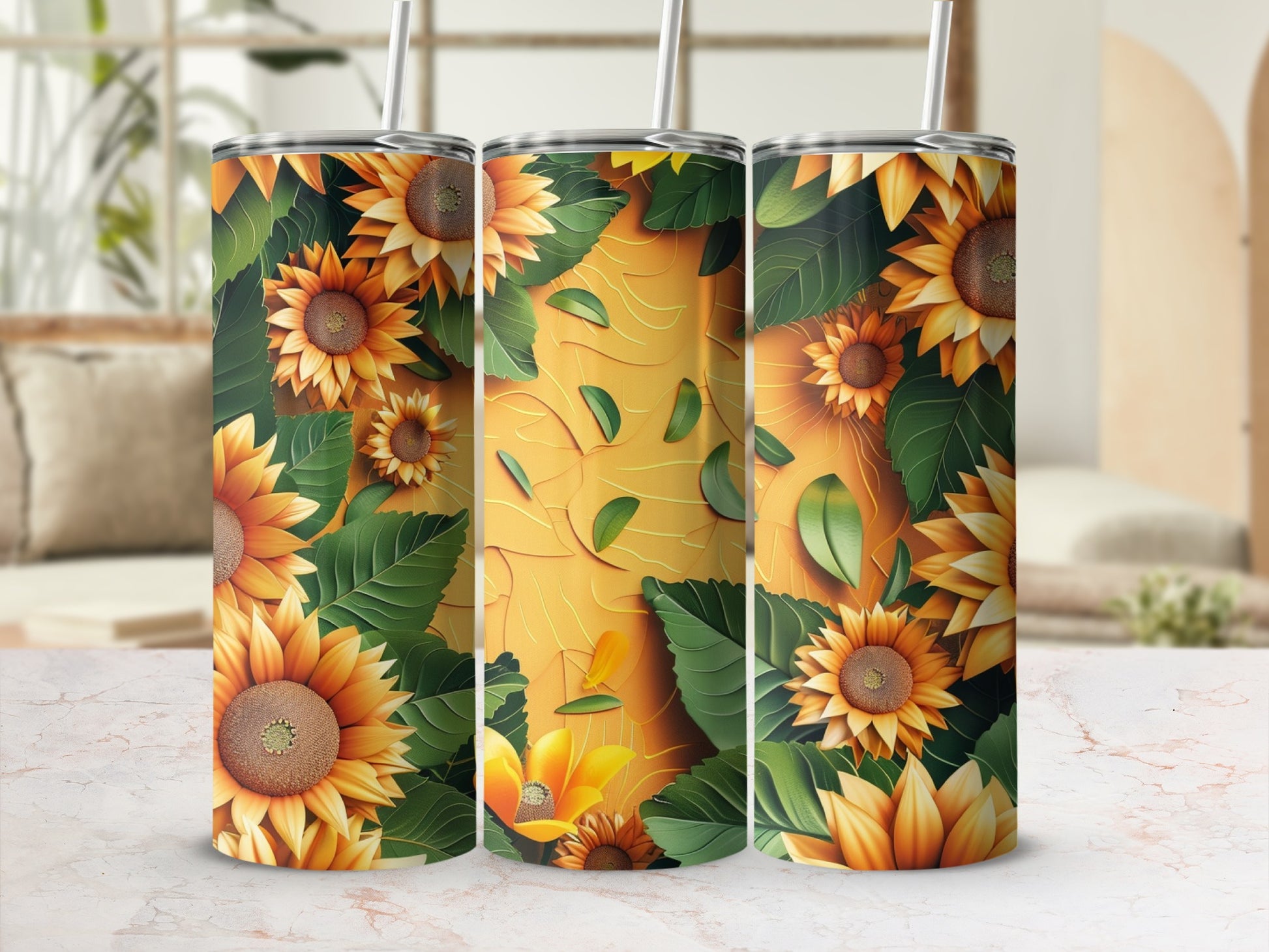 Three tumblers with a sunflower and leaf pattern on a yellow background.