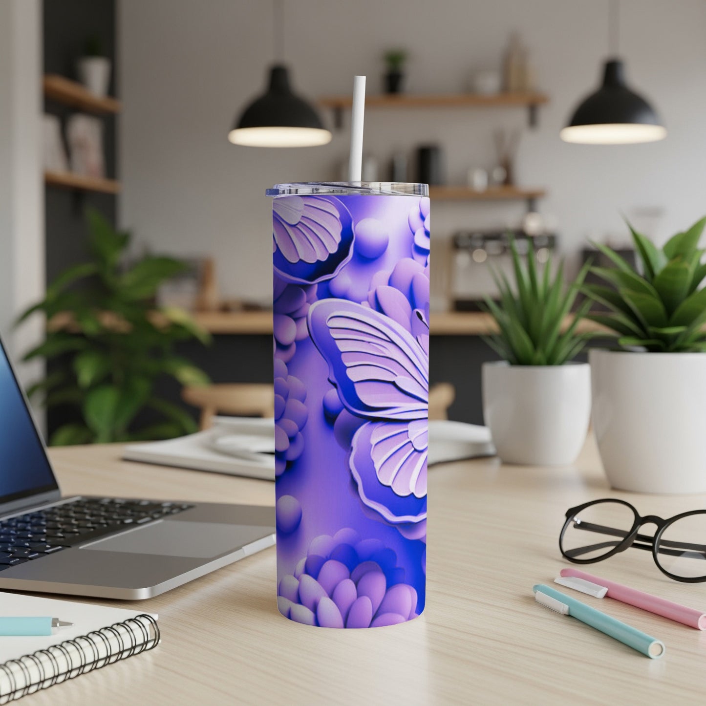 Purple tumbler with butterfly and floral design, straw in place.