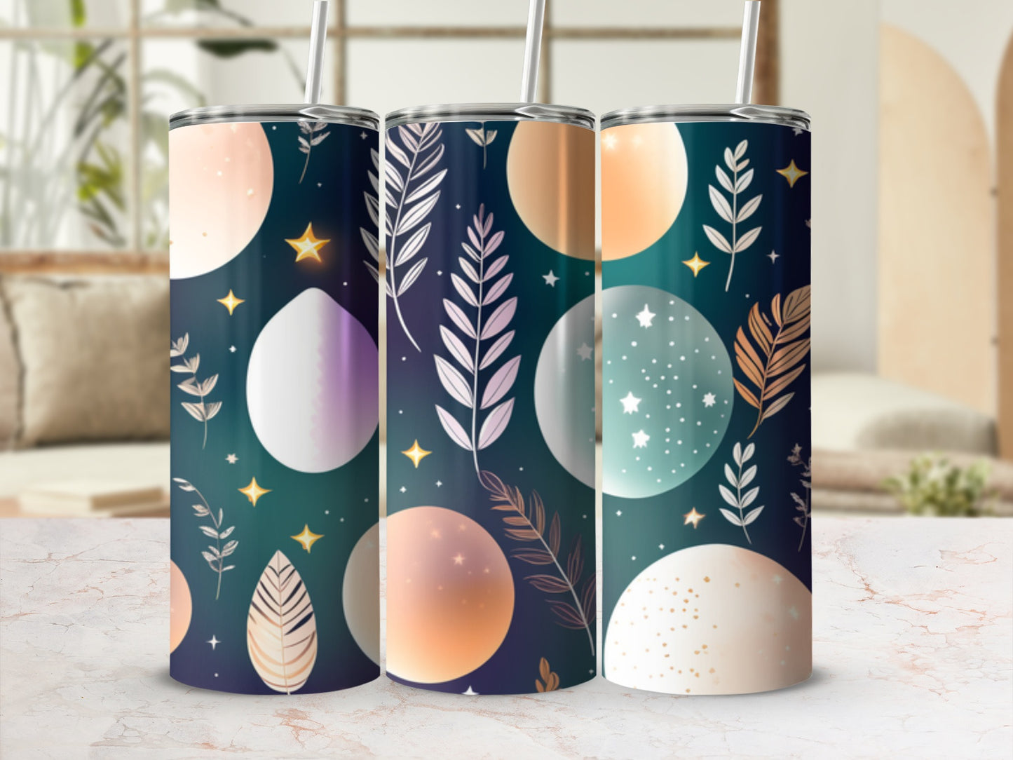 Three tall tumblers with celestial-themed designs in shades of teal and gold.