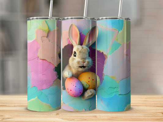 Easter bunny holding colorful eggs against abstract colorful background.