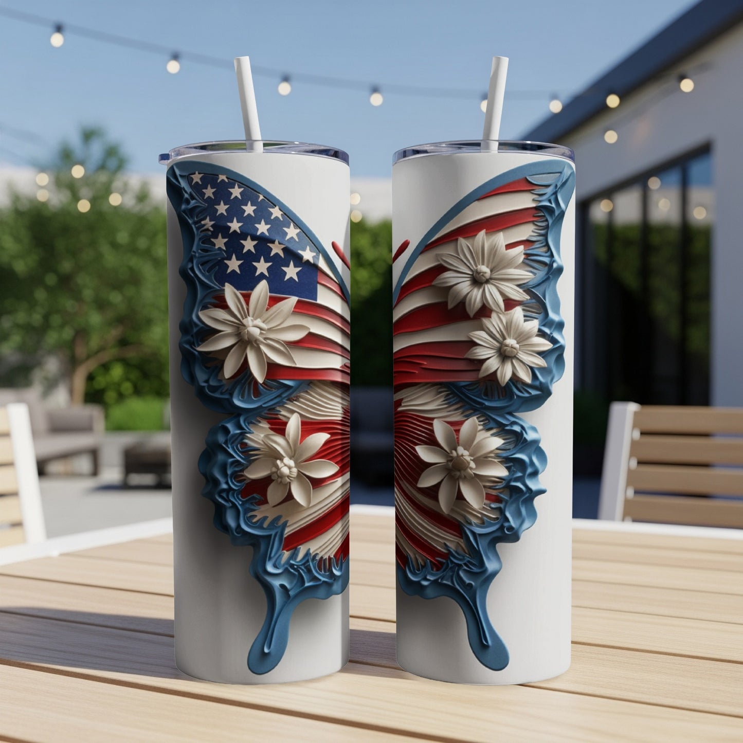 Two white tumblers with American flag butterfly wings and white flowers.