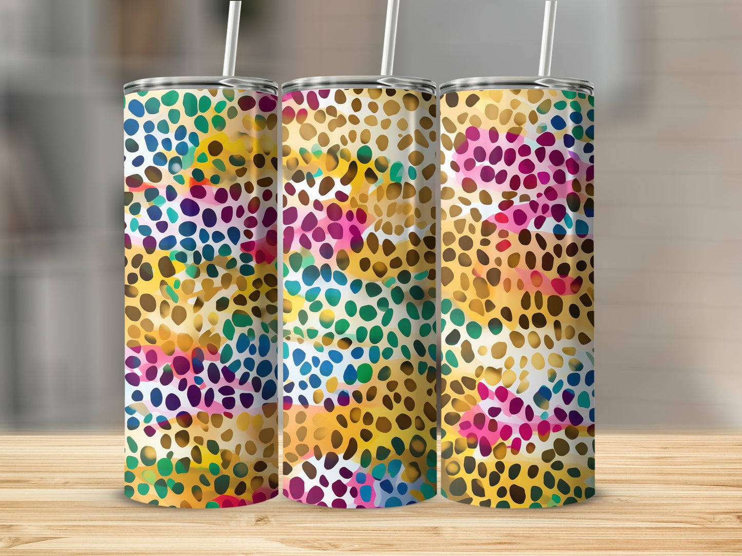 Three tumblers with a colorful abstract splatter pattern.