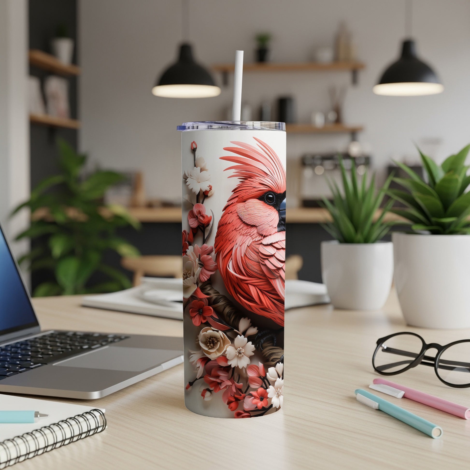 Red cardinal with pink floral pattern on white insulated tumbler with straw.