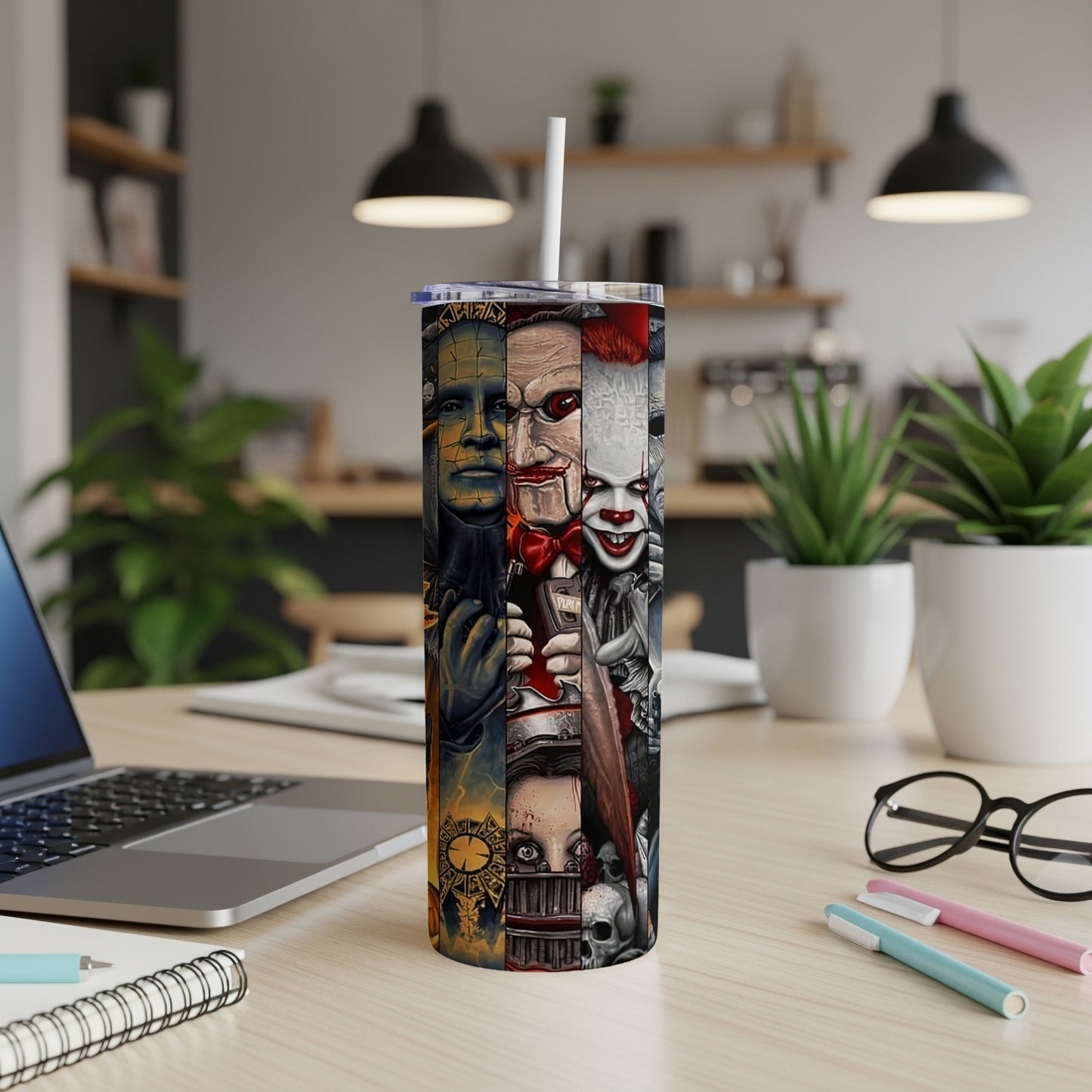 Tumbler with vertical collage of horror movie characters like Pinhead and Pennywise.
