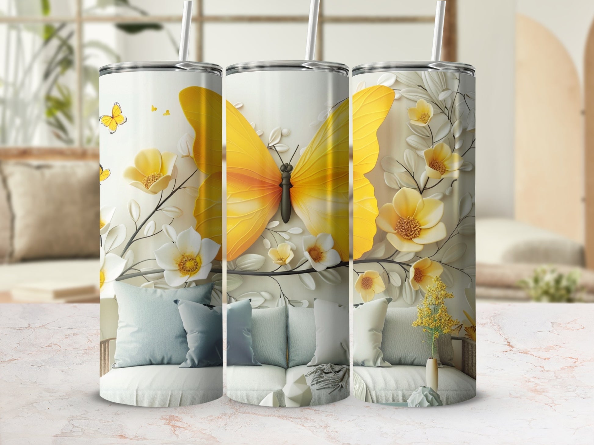 Three tumblers featuring large yellow butterflies and floral designs.