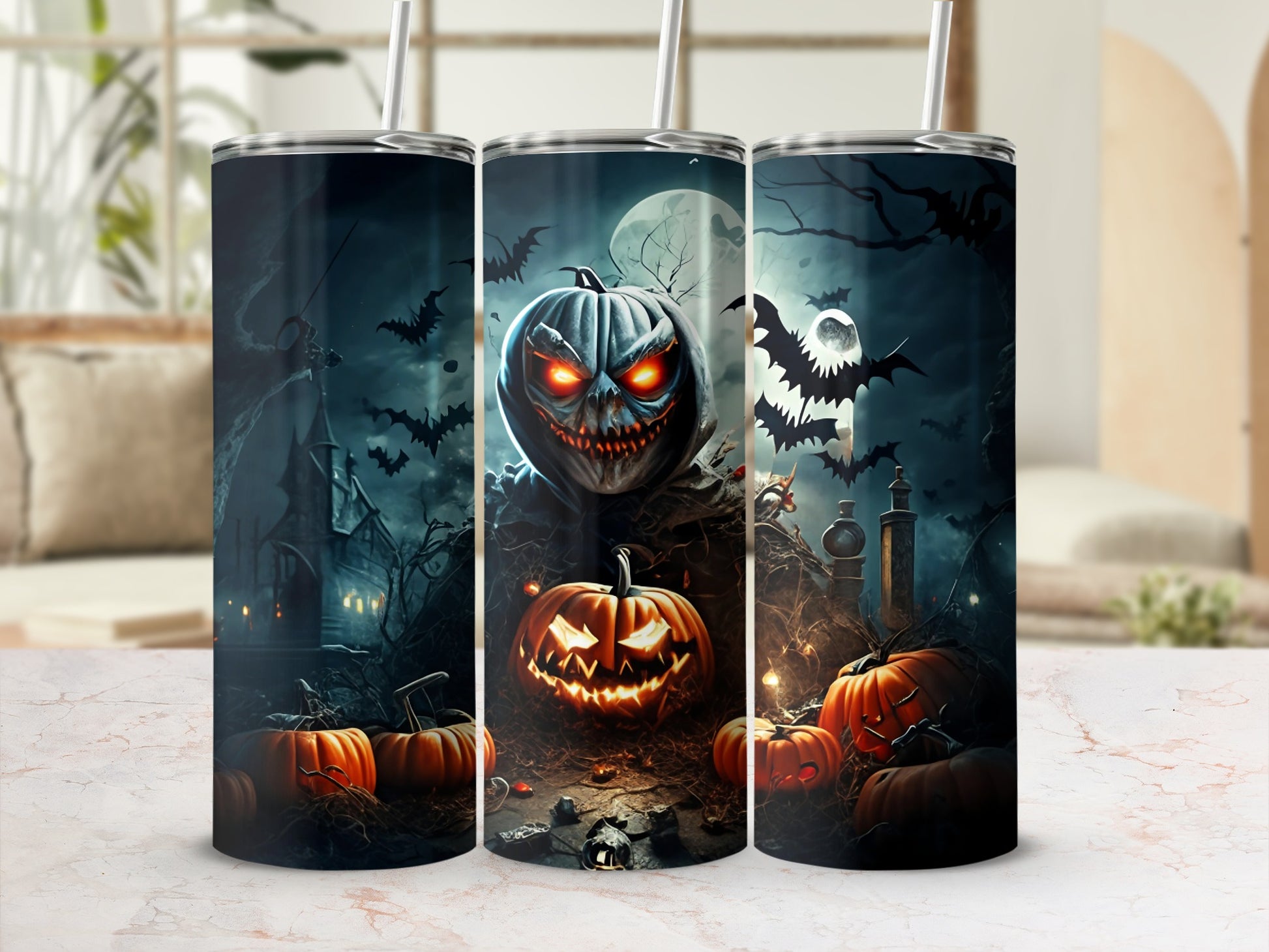 Three tumblers with Halloween designs featuring jack-o'-lanterns, bats, and spooky scenes.