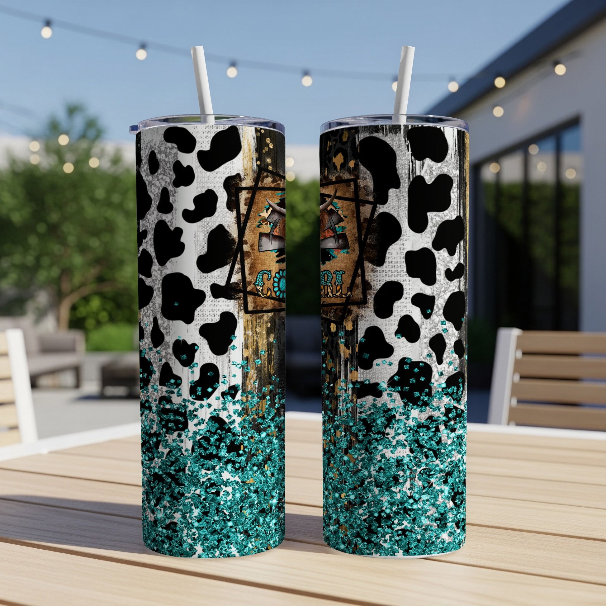 Cow print tumbler with teal glitter and western-themed graphic.