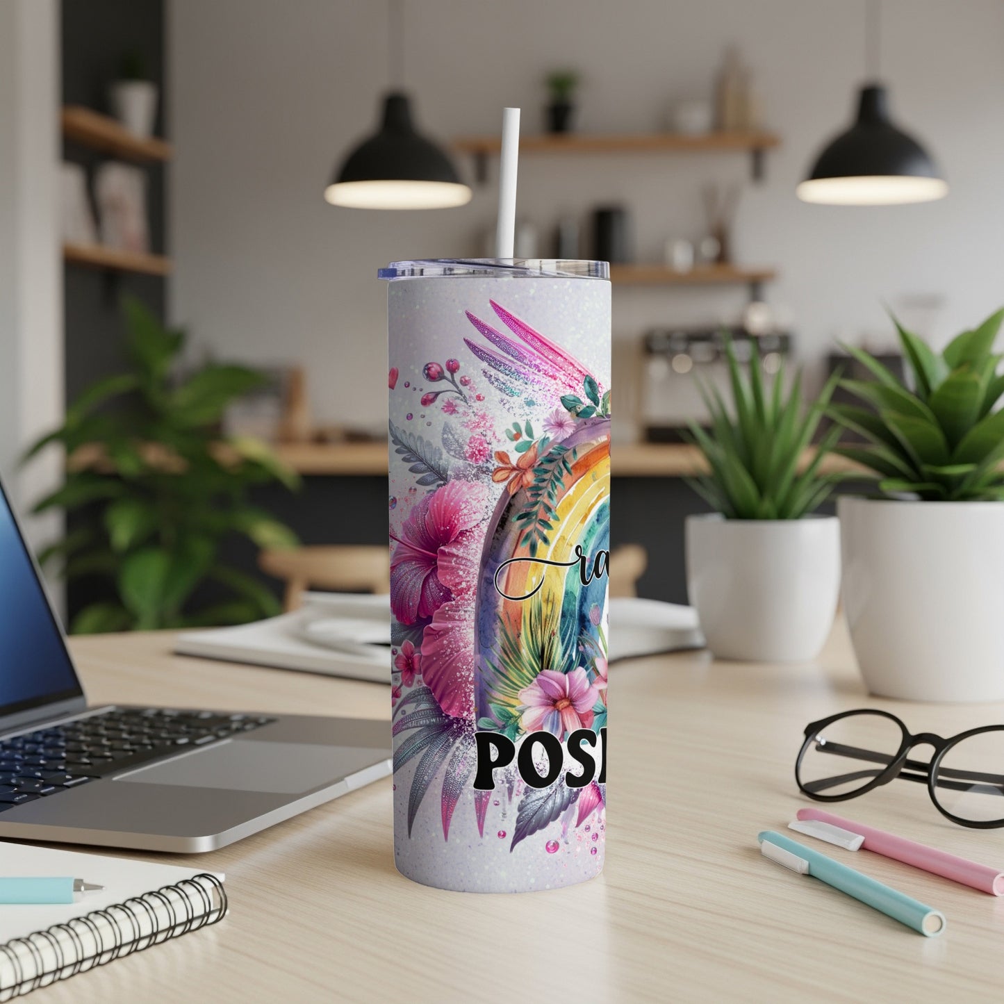 Rainbow and floral pattern tumbler with "Positivity" text.