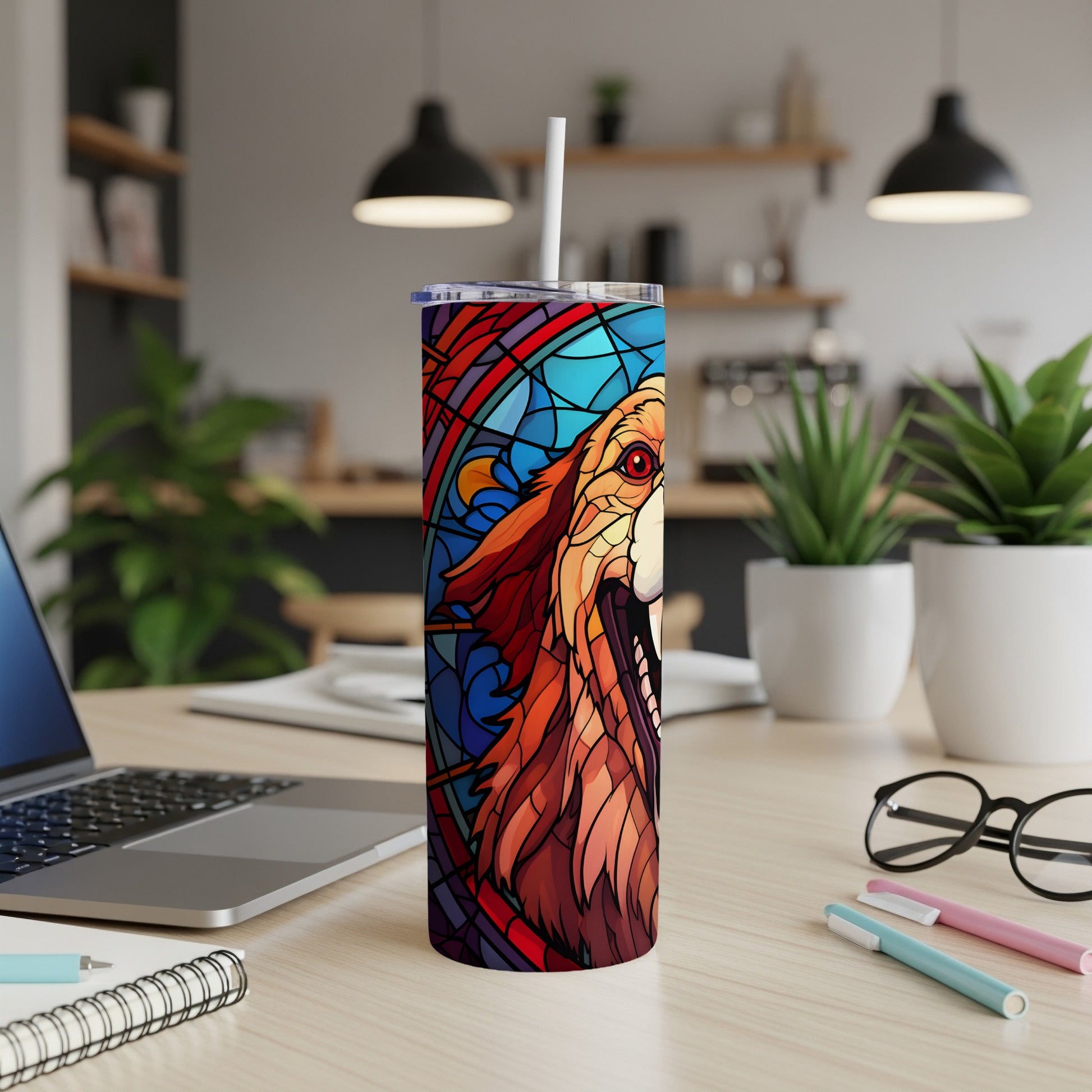 Tumbler featuring a stained-glass style lion's head against a blue and red background.