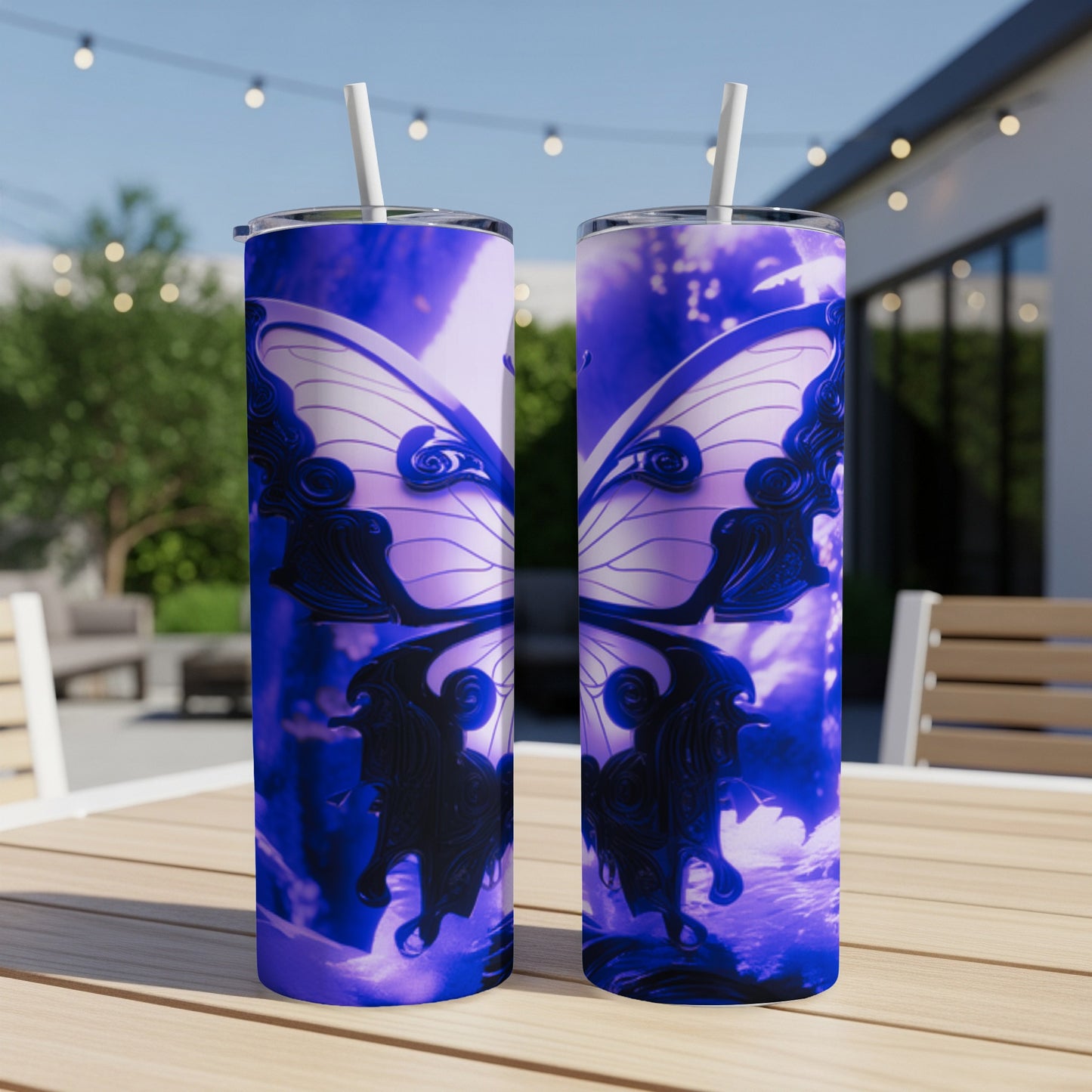 Two purple butterfly design tumblers on a table outdoors.