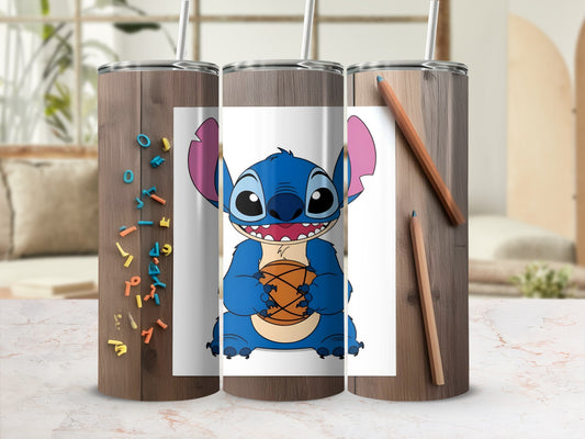 Blue alien character Stitch holding a basketball on a wooden tumbler.