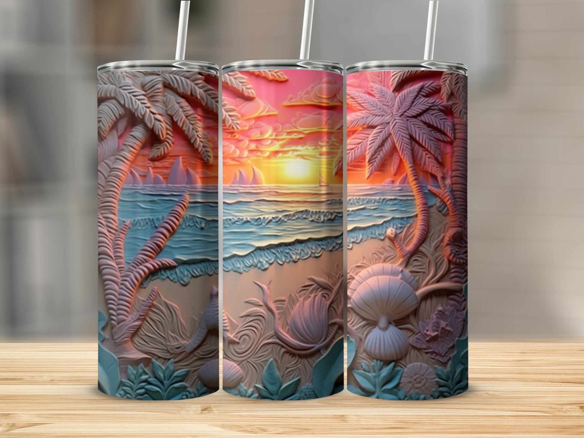 Three tumblers with embossed tropical beach sunset scenes.