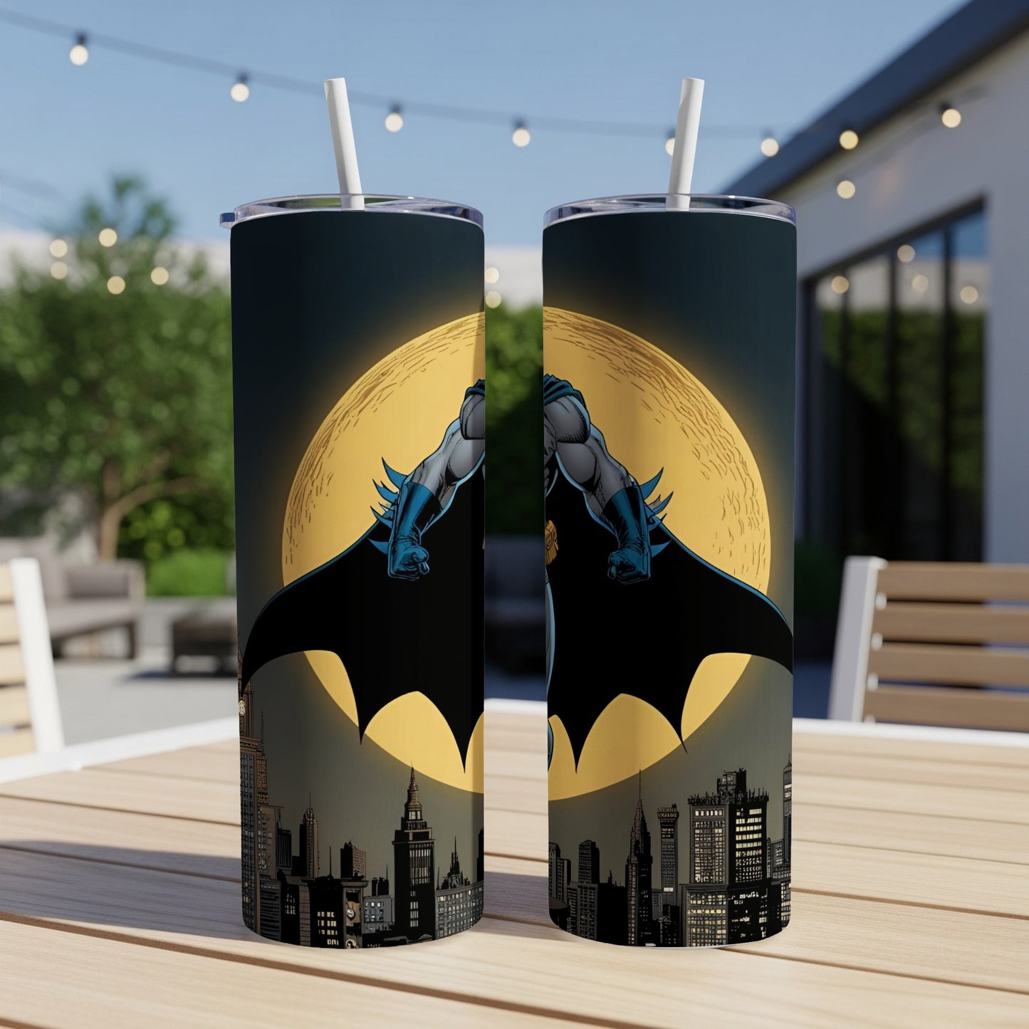 Batman in silhouette against a large moon above a cityscape.