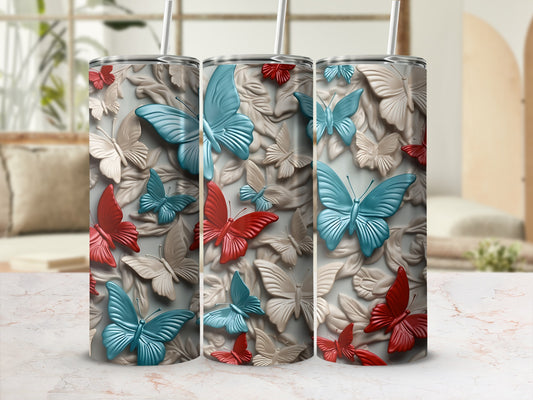 Three tumblers with textured butterfly designs in red, blue, and cream.