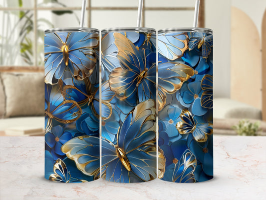 Three tall tumblers with blue and gold butterfly and floral designs.