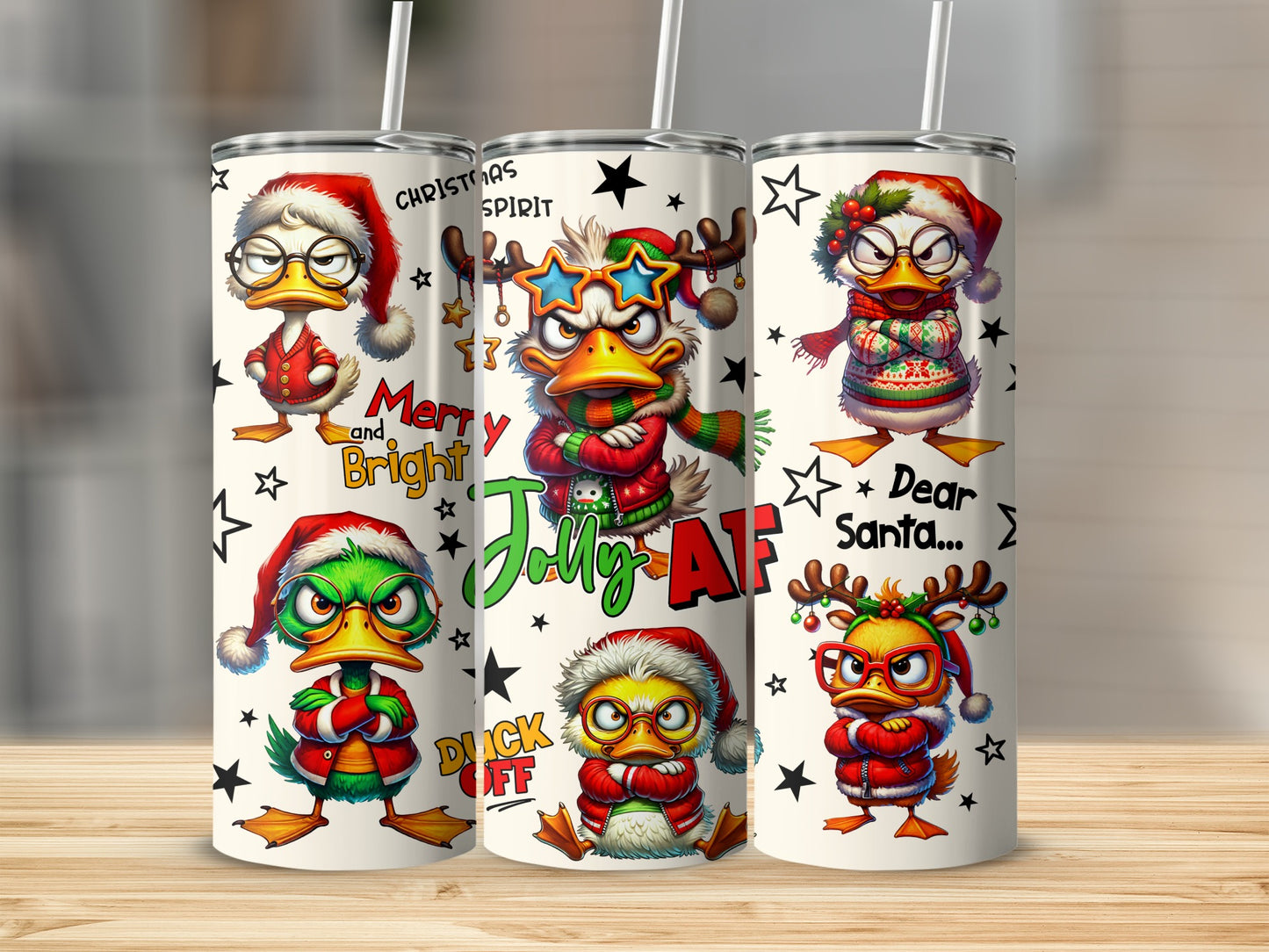 Three Christmas-themed tumblers featuring cartoon ducks with holiday decorations and text.