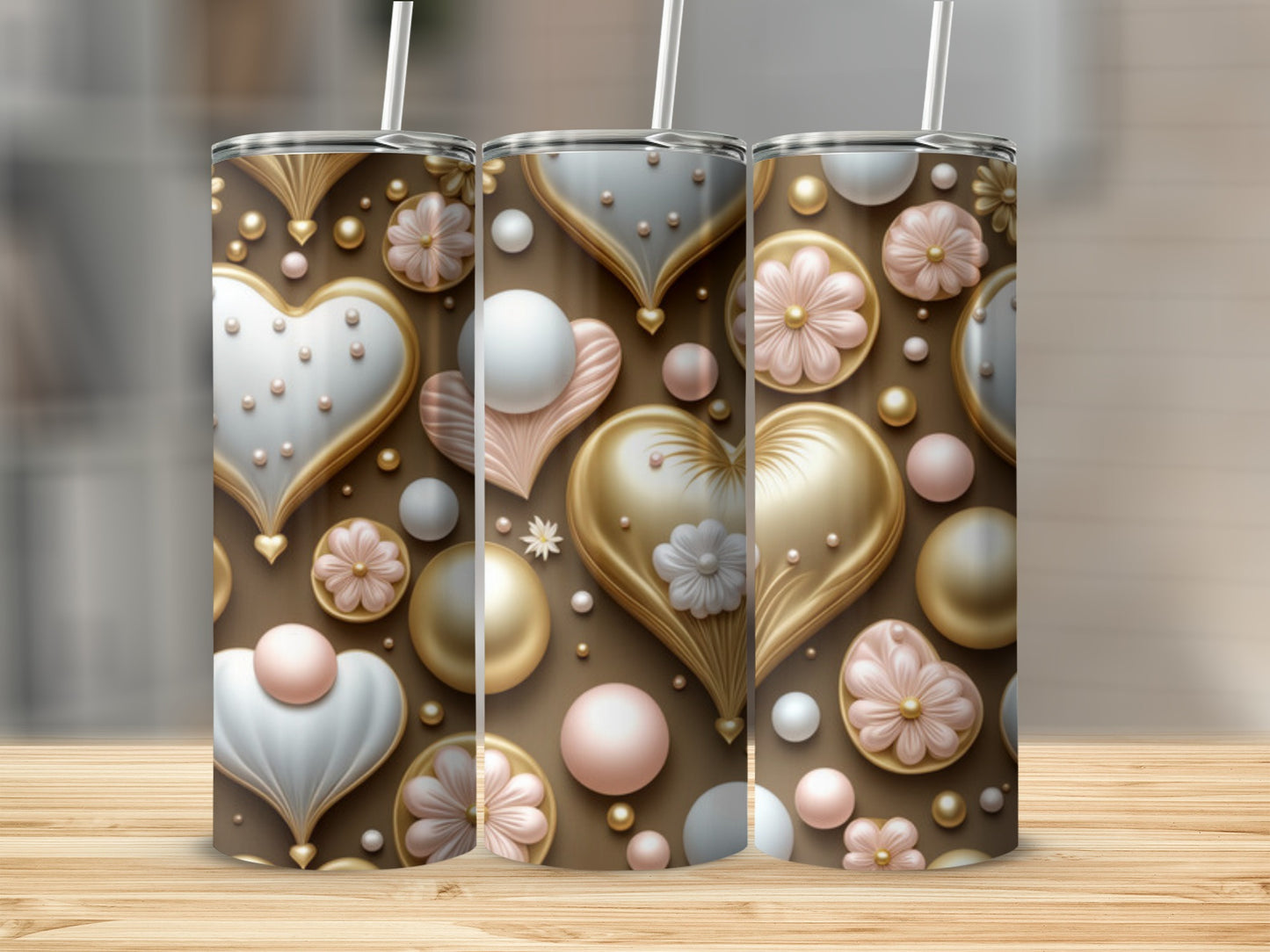 Three tumblers with gold and pink hearts, flowers, and pearls pattern.