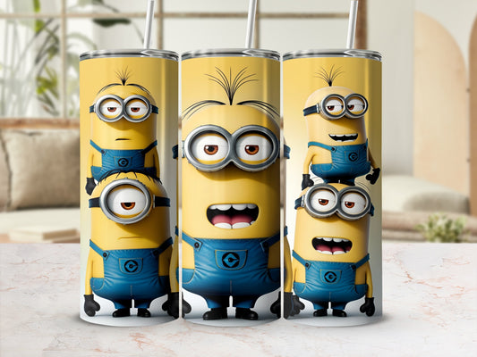 Three Minions from Despicable Me stacked on a yellow tumbler.