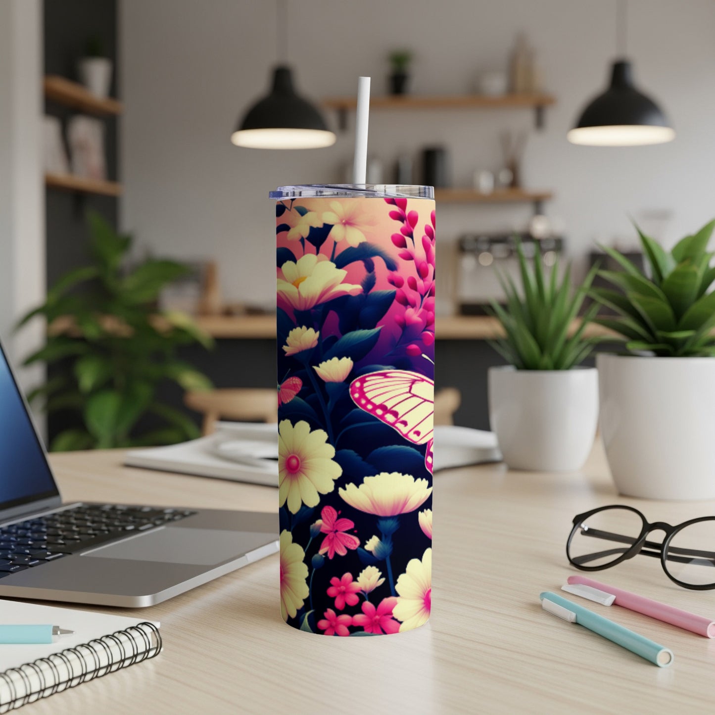 Tall tumbler with pink and yellow flowers and a butterfly.