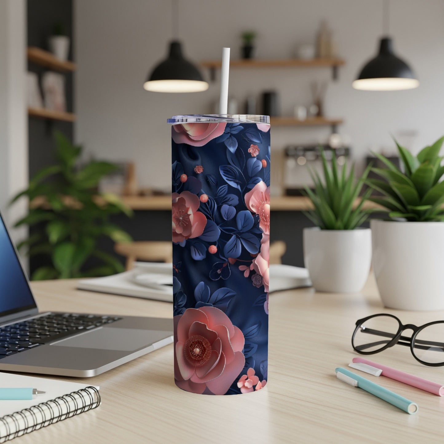 Blue tumbler with dark pink and coral floral pattern.