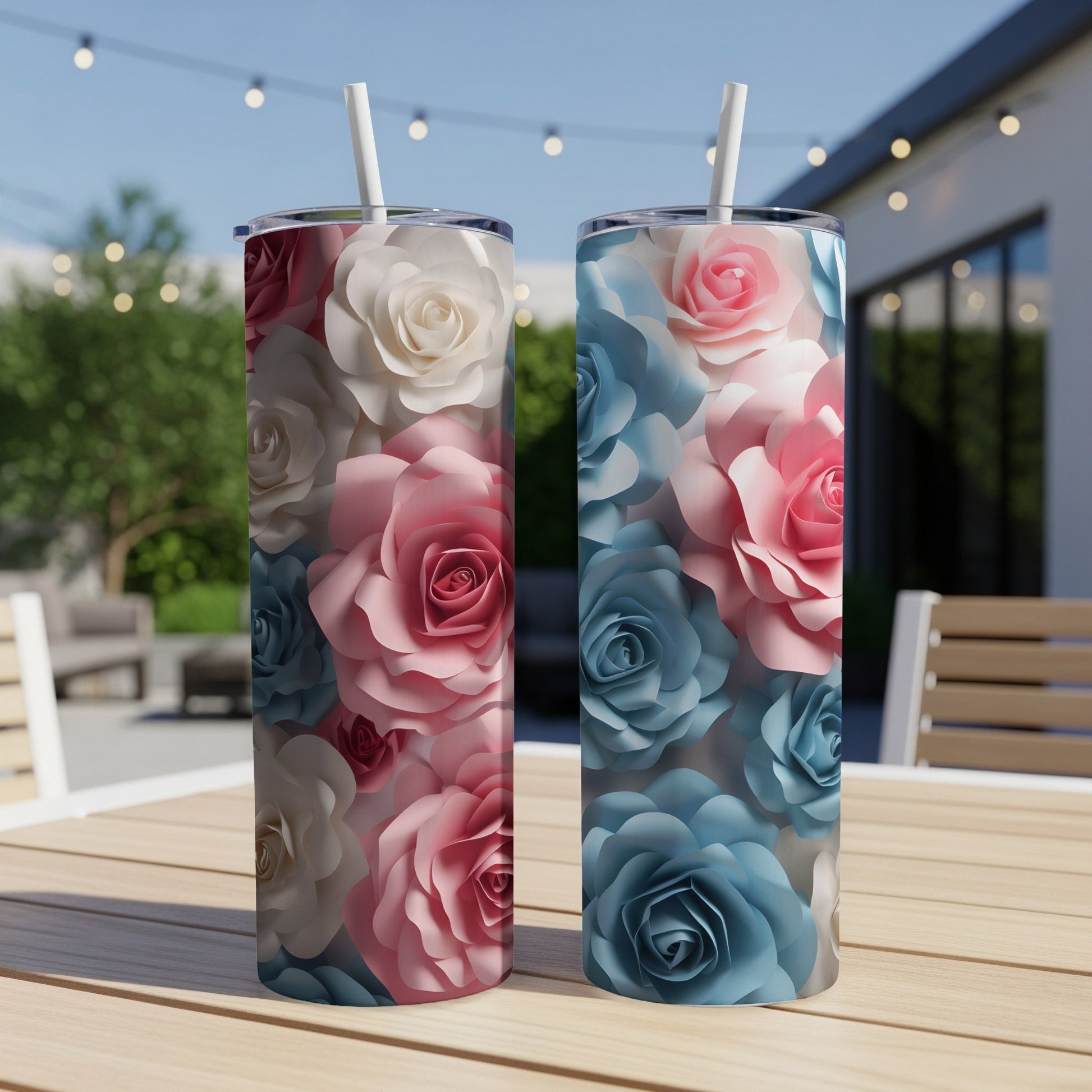 Two tall tumblers featuring a floral pattern of pink, white, and blue roses.