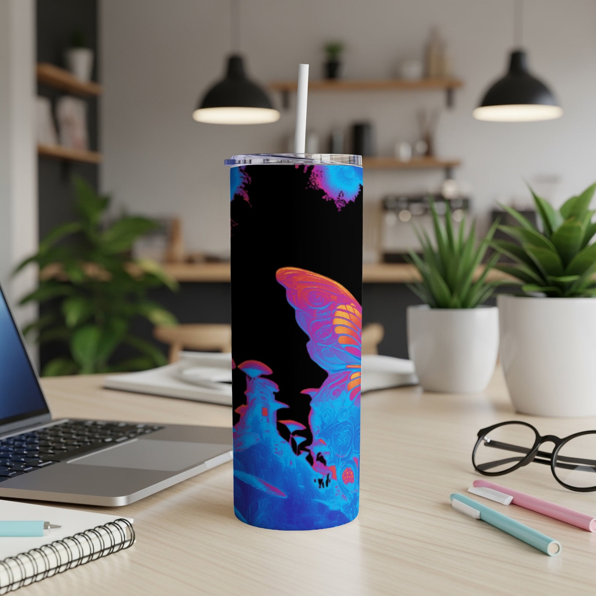 Tumbler with colorful butterfly and abstract background.