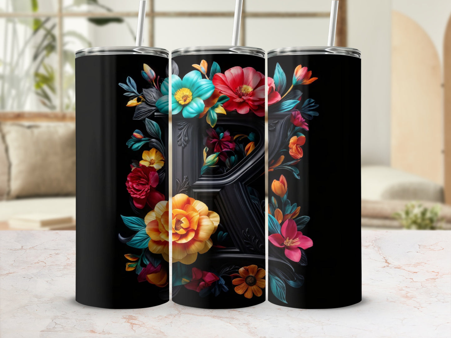 Black tumbler with colorful floral design around a black letter R.