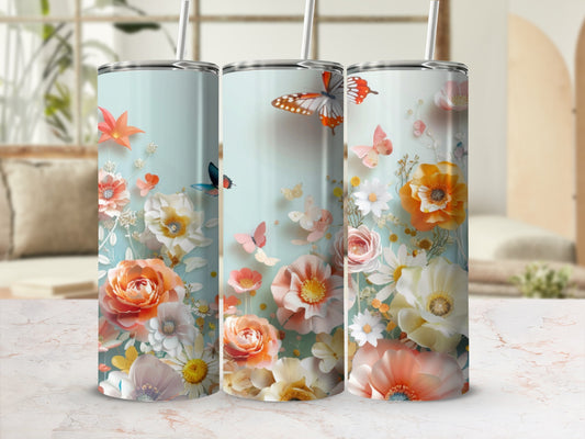 Three floral tumblers with butterflies and flowers, a vibrant springtime design.