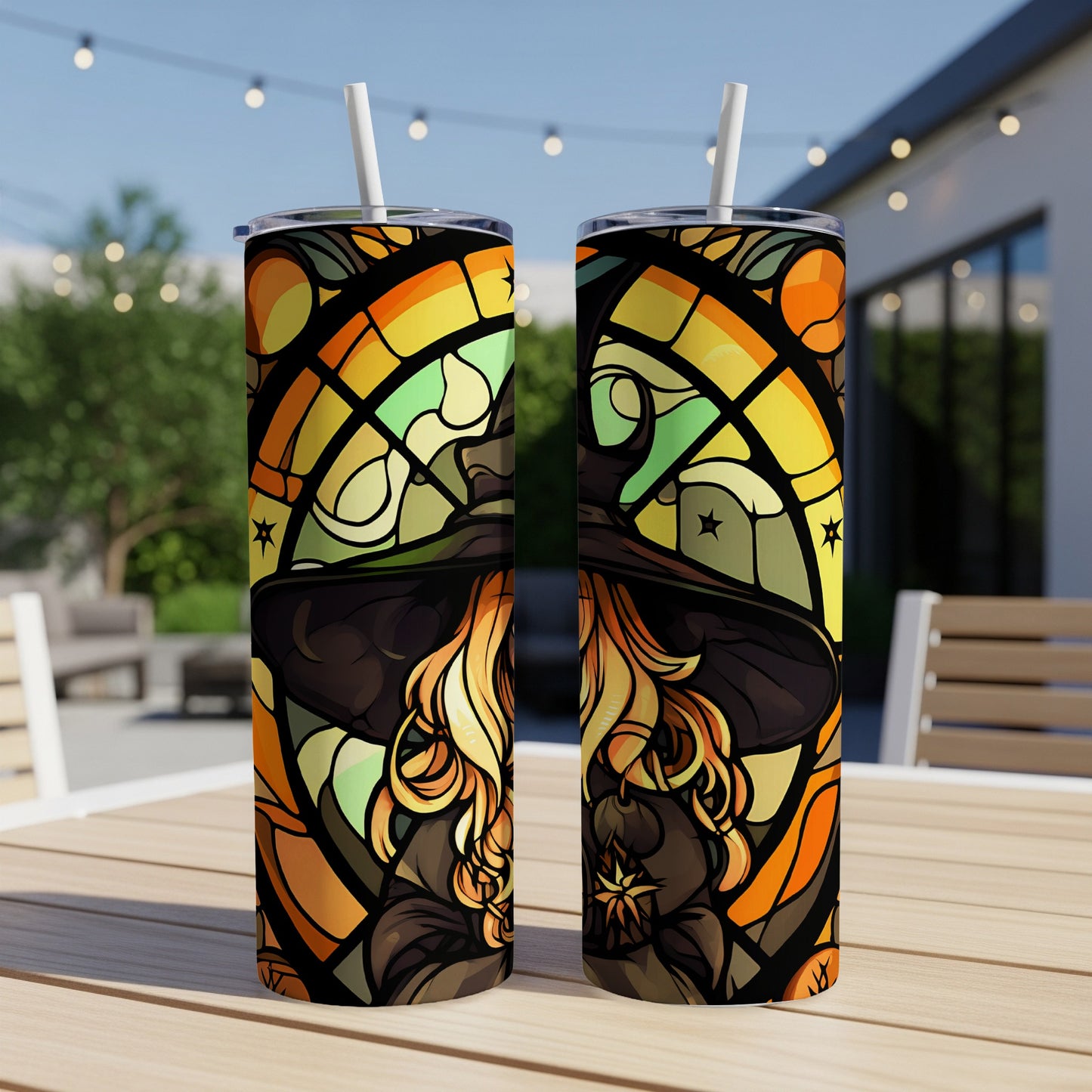Two tumblers with a witch hat stained glass design, outdoors.