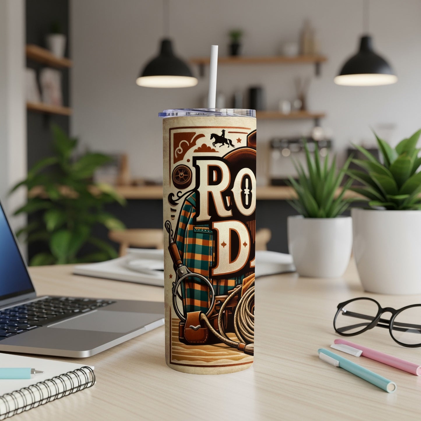 Cowboy rodeo tumbler with plaid, lasso, and magnifying glass.