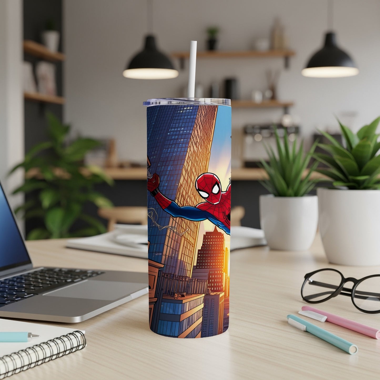 Spiderman swings across a city skyline on a tall, white tumbler.